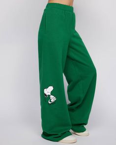 Snoopy & Woodstock Open Leg Pant Wide Leg Cotton Pants With Graphic Print, Cotton Wide Leg Pants With Graphic Print, Green Leisure Pants With Elastic Waistband, Green Sweatpants With Elastic Waistband, Green Baggy Leisure Pants, Green Baggy Pants For Leisure, Baggy Green Pants For Leisure, Green Bottoms With Ribbed Waistband And Relaxed Fit, Green Cotton Sweatpants With Ribbed Waistband