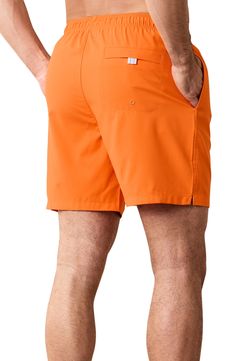 Take a refreshing dip in these sunny-day swim trunks designed with mechanical-stretch fabric, handy pockets and a comfy drawstring waist. 6 1/2" inseam; 24" leg opening; 12 1/2" front rise; 16" back rise (size Medium) Elastic/drawstring waist Side-seam pockets; back reverse-welt pocket Moisture-wicking fabric engineered for dryness and comfort UPF 30 sun protection Mesh liner 100% recycled polyester Machine wash, tumble dry Imported Short Swim Trunks With Pockets For Beach Season, Relaxed Fit Swim Trunks With Pockets For Beachwear, Relaxed Fit Swimwear With Pockets For Beach Season, Beachwear Bottoms With Elastic Waistband For Travel, Functional Beach Shorts For Summer, Functional Shorts For Beach, Casual Pool Shorts With Side Pockets, Functional Summer Beach Shorts, Summer Travel Bottoms In Short Length