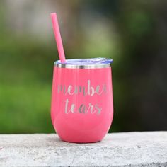 a pink tumbler with the words member tears on it and a straw sticking out of it