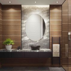 a bathroom with a sink, mirror and towel rack on the wall next to it