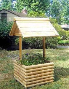 a small wooden structure in the middle of a yard