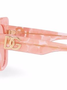 Bubble pink acetate DG Crossed sunglasses from DOLCE & GABBANA EYEWEAR featuring cat-eye frame, tinted lenses, logo plaque at the arm, straight arms, curved tips and curved nose bridge. These glasses come with a protective case.. | Dolce & Gabbana Eyewear DG Crossed sunglasses Curved Nose, Dolce And Gabbana Eyewear, Sunglasses Pink, Cat Eye Frames, Nose Bridge, Glasses Accessories, Cute Jewelry, Dress Accessories, Slip On Sandal