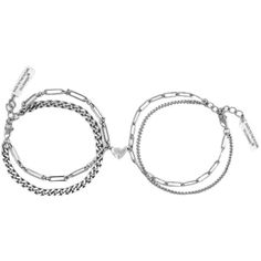 two silver bracelets with chains and charms on each side, one in the shape of a heart