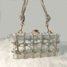 • Fashionable Design :The Rhinestone Purse Hand Bag is a trendy accessory for 2024, perfect for adding a touch of elegance to any outfit. • Versatile Usage :Ideal for parties, this bag offers a versatile and stylish accessory that can enhance your look. • Durable Material :Made from Acrylic, this bag is hard and durable, ensuring long-lasting use. • No Pockets :The interior of this bag is solid without pockets, keeping it simple and chic. • Embellished Decoration :Adorned with diamonds, this bag adds a touch of glamour to your ensemble. • Easy Closure :Featuring a hasp closure, this bag is easy to open and close, ensuring secure storage. Size: Length:20cm(7.87inch) width: 7cm(2.76 inch) Height: 10cm (3.94inch)Manual measurement with 1-3cm errorFabric: Acrylic Tip: Dear buyer friends, our s Glamorous Square Shoulder Bag, Chic Rectangular Shoulder Bag With Rhinestones, Chic Rectangular Rhinestone Shoulder Bag, Chic Bags With Rhinestones For Fashion Accessory, Chic Rhinestone Bags For Fashion Accessory, Trendy Embellished Clutch Bag, Chic Embellished Rectangular Shoulder Bag, Rectangular Clutch With Rhinestones, Trendy Rectangular Shoulder Bag With Rhinestones