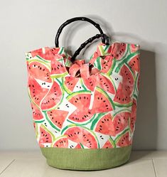 a watermelon print bag hanging on a wall