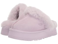 UGG Disquette - Women's Shoes : Lavender Fog : Elevate your comfort game with the UGG Disquette slipper. Premium construction and materials. Secure and comfortable fit. Slip on mule style. Open back. Cushioned footbed. Fur lined. Real, dyed fur from sheep originating from United States, UK, Spain, Ireland, Australia. Suede leather upper. Sheepskin collar, lining, and footbed. Synthetic outsole. Imported. Lavender Uggs, Purple Uggs, Pink Ugg Slippers, Uggs Slippers, Descendants Dr, Ugg Shoes Women, Ugg Store, Pretty Sneakers, Pink Uggs