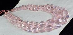 PRODUCT DETAILS LINE 3/CTS 1415 ROSE QUARTZ TUMBLE NECKLACE ALL NATURAL UNHEATED UNTREATED BIGGEST SIZE OF THE BEADS IS 24 MM SMALLEST SIZE OF THE BEADS IS 11MM INNER LENGTH OF THE NECKLACE IS 18 INCHES EXCELLENT QUALITY ATTACHED TO SILK CORD BEST PRICE OFFERED NOTE - #You will receive the same product you see in picture. #DEAR ETSY BUYERS PLEASE FEEL FREE TO ASK QUESTIONS #WE WILL BE GLAD TO ANSWER & SOLVE QUERY REGARDING THIS PRODUCTS #RETURN POLICY Every piece of jewellery and inputs (gem Elegant Necklace With Large Oval Beads, Elegant Pink Beaded Necklaces With Oval Beads, Elegant Pink Oval Beaded Necklaces, Beaded Rose Quartz Necklaces With Faceted Round Beads, Gift Rose Quartz Necklace With Faceted Beads, Rose Quartz Necklace With Faceted Round Beads, Pink Rose Quartz Round Necklaces, Hand-strung Pink Rose Quartz Necklace, Silk Cord