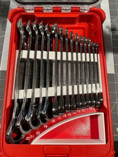 a red tool box filled with lots of tools