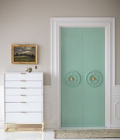 an instagram page with a white dresser and green glass door in the corner, on top of a light blue wall