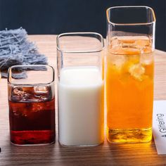 three different types of drinks on a table