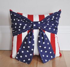 an american flag bow pillow on the floor