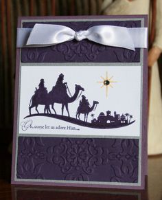 a handmade card with three wise men riding on camels