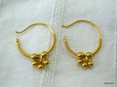 traditional design 20kt gold hoop earring pair from rajasthan india. nice handmade design made of 20kt yellow gold, good for jewellery collection. weight - 1.1 grams size - 1.8/1.4 cm material - 20kt yellow gold. 22k Gold Round Earrings For Puja, Traditional Small Hoop Gold Earrings, Traditional Gold Hoop Nose Rings, Handmade Gold Earrings For Puja, Traditional Small Hoop Hallmarked Earrings, Traditional Small Hoop 22k Gold Earrings, Traditional Small Hoop Gold Plated Earrings, 22k Gold Temple Jewelry Hoop Earrings, Traditional 22k Gold Small Hoop Earrings