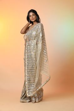 Radiate glamor on special occasions in this beautiful cream diamond applique work designer net saree. It comes with a matching saree blouse. Shop designer sarees in USA from Pure Elegance. Disclaimer: The actual product may vary slightly from the image. These are custom orders, hence expect slight variation in color, placement of the motif or buta. ESTIMATED DELIVERY Because this is a custom order, it would take about 4 weeks from the date of purchase. RETURN POLICY This product is a custom orde Cream Saree Blouse Piece With Sheer Dupatta, Bollywood Style Cream Pre-draped Saree For Festive Occasion, Cream Pre-draped Saree With Sheer Dupatta For Festive Occasions, Festive Cream Pre-draped Saree With Sheer Dupatta, Bollywood Style Cream Pre-draped Saree With Zari Work, Festive Designer Cream Pre-draped Saree, Festive Cream Pre-draped Saree With Dupatta, Designer Cream Pre-draped Saree With Zari Work, Semi-stitched Cream Saree For Festive Occasions