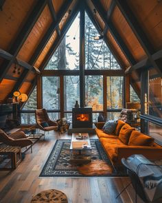 a living room filled with furniture and a fire place in the middle of a loft