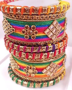 Colourful set of handmade bangles set with champagne coloured kundan stones. They will fit right in with any of your outfits 10 bangles per set Available in following sizes 2.4 (2.25 inches inner diameter) 2.6 (2.37 inches inner diameter) 2.8 (2.5 inches inner diameter) 2.10 Bangles shipped will be as shown in the picture, however actual colours may vary slightly from those shown due to the nature of photographing and colour settings Luxury Multicolor Bangle For Festive Season, Luxury Multicolor Bangle As Gift, Bangles Set, Thread Bangles, Handmade Bangles, Bangle Set, Champagne Color, Bangle Bracelets, Dj