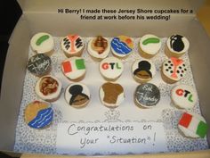 cupcakes in a box with congratulations written on the top and bottom, all decorated like flags