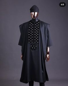 Traditional Black Agbada With Dabka, Traditional Black Agbada With Dabka Detailing, Traditional Black Agbada For Ceremonies, Traditional Agbada Tunic For Eid, Traditional Eid Agbada Tunic, Traditional Agbada In Ankara Fabric, Fitted Traditional Agbada In Ankara Fabric, Fitted Traditional Ankara Fabric Agbada, Fitted Ankara Fabric Agbada In Traditional Style