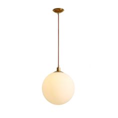 a white ball hanging from a brass colored light fixture on a white wall with a black cord