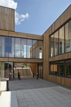 an empty courtyard in front of some wooden buildings