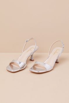 Whether you're the best-dressed guest or the bride-to-be, the Lulus Soline Silver Metallic Slingback Low Heel Sandals are perfect for any special occasion! Shiny, smooth faux leather shapes these luxe heels that feature a trendy square footbed, a tapered toe strap, and a slender, adjustable slingback strap that secures with a silver buckle. A unique, sculpted heel completes the simple and sensational design. 2. 75" sculpted heel. Cushioned insole. Rubber sole has nonskid markings. Man made mater Low Heel Sandals, Silver Heels, Heel Sandals, Low Heels, The Bride, Metallic Silver, Rubber Sole, Nice Dresses, Sandals Heels