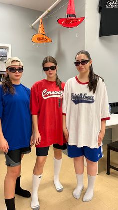 three young women standing next to each other