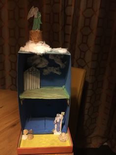 a dollhouse made to look like it is in the clouds