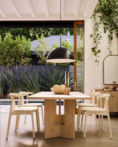 a dining room table with chairs around it