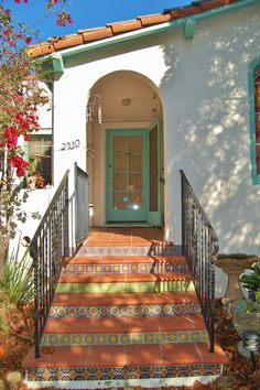 an entry way to a home with steps leading up to the front door