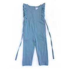 Introducing our must-have piece for the warmer seasons - the Medium Blue Linen Ruffle Romper with Pants. Made from high-quality linen fabric, this romper exudes effortless style and comfort. The functional buttons in the back and waist tie add a touch of functionality to this chic piece. Perfect for any occasion, this romper fits true to size and will become a staple in your wardrobe. Welcome spring and summer with this versatile and stylish romper, available now on our e-commerce store. Casual Cotton Jumpsuits And Rompers With Ruffles, Spring Ruffle Overalls, Spring Ruffled Overalls, Cotton Jumpsuits And Rompers With Ruffles, Chic Cotton Jumpsuit With Ruffles, Chic Cotton Jumpsuits And Rompers With Ruffles, Casual Ruffled Overalls For Spring, Blue Cotton Jumpsuit With Ruffles, Cotton Jumpsuit With Tie Waist And Relaxed Fit