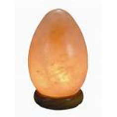 an egg shaped lamp sitting on top of a table