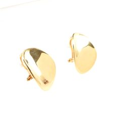 Surprise your favorite lady (or treat yourself) with these gorgeous omega earrings! These exquisite 14 karat solid yellow gold pair of earring jackets features a flower form. Wear them with your own studs. Each jacket measures 23.44 millimeters (15/16 inch) long by 17.27 millimeters (11/16 inch) deep. The pair weighs 6.19 grams and are stamped 14K and signed FC ITALY. Good estate condition. We are listing several pieces of estate jewelry, along with other items fresh from fine North Carolina est Modern Polished Clip-on Earrings For Anniversary, Modern Yellow Gold Clip-on Earrings With Polished Finish, 14k Yellow Gold Polished Clip-on Earrings, Classic Polished Clip-on Earrings For Anniversary, Classic Polished Finish Clip-on Earrings For Anniversary, Classic 14k Gold Tarnish Resistant Clip-on Earrings, Classic 14k Gold Clip-on Earrings With Polished Finish, Classic 14k Gold Clip-on Earrings, Classic 14k Yellow Gold Clip-on Earrings