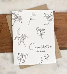 a greeting card with hand drawn flowers on it