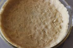 an uncooked pie crust in a glass bowl