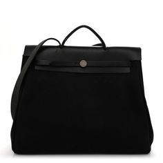 This is an authentic HERMES Toile Vache Calfskin Herbag 39 MM in Black. This stylish bag is crafted of black toile canvas. The bag features a black leather crest with leather top handles, a shoulder strap, and polished palladium plated hardware. The opens to a black fabric interior with a removable pouch. Black Luxury Coated Canvas Satchel, Luxury Black Coated Canvas Satchel, Classic Black Briefcase In Coated Canvas, Black Coated Canvas Briefcase For Daily Use, Classic Black Coated Canvas Briefcase, Designer Canvas Bag With Detachable Handle For Travel, Black Top Handle Shoulder Bag In Coated Canvas, Luxury Canvas Bag With Top Handle, Luxury Black Coated Canvas Bag