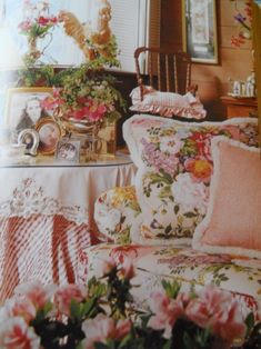 an image of a bedroom setting with flowers on the bedspread and furniture in the background