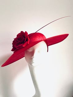 Red flower fascinator  Red flower fascinator  will be an amazing accessory to compliment your outfit. The colours can easy pick the colours you would be wearing. It will fit an average head size. The widest point of the hat- across, is 52 cm Its made from silk covered headband attached to the red colour sinamay saucer disc on which sits red roses and a feather. Enjoy your special day with this beautiful headpiece! Red Headpieces Suitable For Summer Gifts, Red Headpieces For Summer Gifts, Red Headpieces As Summer Gifts, Elegant Rose Hat For Kentucky Derby, Red Handmade Flowers Fascinator For Spring, Elegant Rose Fascinator For Kentucky Derby, Red Hats For Spring Gifts, Red Spring Hat For Gift, Red Spring Hat As Gift