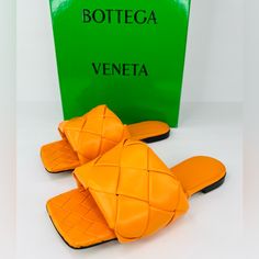 Bottega Veneta -Condition: Brand New Store Display Item With Box + Dust Bag. -All Of Our Items Are 100% Authentic. -Size: Eu 35 - Us 5 -Color: Tangerine -Model: Lido. -Intrecciato Leather Flat Sanda -Material: 100% Lambskin. -Lining: Lambskin. -Open Toe Slip-On Sandals. -Rubber-Injected Leather Outsole. -Made In Italy. -Retails For $1,350.00 -Item Ships Out Within 24 Hours. Luxury Orange Leather Sandals, Designer Yellow Leather Sandals, Luxury Yellow Leather Sandals, Luxury Leather Sandals With Intrecciato Weave, Designer Woven Leather Evening Sandals, Designer Leather Sandals With Intrecciato Weave, Luxury Orange Sandals With Removable Insole, Designer Orange Sandals With Round Toe, Luxury Orange Evening Sandals