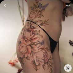 a woman's stomach with flowers on it