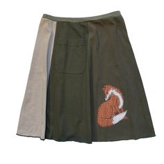 "Classic Appliqué skirts are made with high quality, up-cycled t-shirts. Freestyle sewn images are appliquéd on panels of various colors making each skirt unique and interesting.  Each skirt has a convenient pocket. Since there is no real \"front\" or \"back\"of this skirt, simply place the pocket where you like. The 21\" length, a-line cut, elastic waist and up-cycled knit fabric create an ultra comfortable skirt that will be your best friend all year long. EACH SKIRT IS MADE TO ORDER AND UNIQU Cotton Patchwork Mini Skirt, Casual Reworked Skirt For Summer, Casual Reworked Summer Skirt, Retro Cotton Patchwork Skirt, Fitted Cotton Skirt With Reworked Details, Spring Cotton Skirt Upcycled, Upcycled Cotton Summer Skirt, Casual Upcycled Denim Skirt, Fitted Cotton Patchwork Skirt