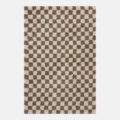 a brown and white rug with squares on the bottom, one side has a checkerboard pattern