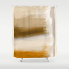 an abstract shower curtain with brown and white paint on the bottom, in front of a gray background