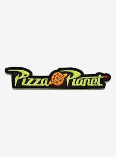 the pizza planet logo patch is shown on a white background with black and green lettering