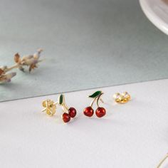 14K Solid Gold Cherry Earrings, Dainty Red Cherries Earrings, Cute Minimalist Fruit Earrings, Tiny Summer Jewelry, Gİft For Her The material is 14k solid gold (not gold filled or gold plated). M o r e * F r o m * U s Goldstore Jewelry - https://etsy.me/3gHtcrZ * Editor's Pick - https://etsy.me/3CCLlmm * Cremation Urn Jewelry - https://etsy.me/3MM0Lcq * Stud Eearrings - https://etsy.me/3t4ZhlR * Diamond Earring - https://etsy.me/3i2NzCc * Birthstone Earring - https://etsy.me/3tYzWcO * Evil Eye Ea Cherry Colored Earrings Gift, Cherry Color Earrings For Valentine's Day Gift, Cherry Earrings For Valentine's Day Gift, Cherry Colored Earrings For Valentine's Day Gift, Small Red Jewelry Perfect For Gifting, Small Red Jewelry For Gift, Red Hypoallergenic Dainty Earrings, Red Enamel Earrings For Anniversary, Red Dainty Earrings For Anniversary