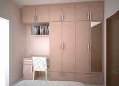 a bedroom with pink cupboards and a white bed