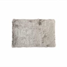 a gray furry pillow on a white background