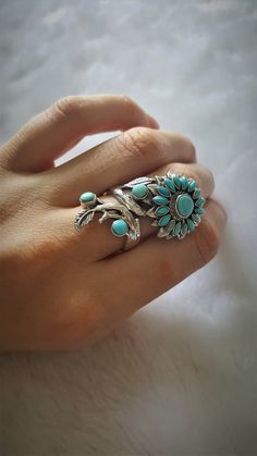 Flower Turquoise Ring. Exclusively Handmade Sterling Silver Ring with Natural Turquoise. Handmade, one of a kind Masterpiece Turquoise Flower Ring Ring weighs 13.5 grams. Size can be Adjusted Please allow 2-3 weeks shipping as we are in Bangkok Thailand at this time We are a Los Angeles based company operating out of Thailand so that we may bring you the highest quality items at the most competitive prices. Just search and compare. We only offer authentic items. What we describe in our listings Unique Piercings, Sunflower Ring, Sterling Silver Rings Turquoise, Handmade Sterling Silver Rings, Turquoise Ring Silver, Western Jewelry, Turquoise Rings, Exclusive Gift, Fabulous Jewelry