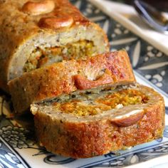 a loaf of meatloaf on a blue and white plate