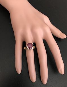 4.90 Carats Impressive Red Ruby and Diamond 14K Yellow Gold Ring Suggested Replacement Value $2,900.00 Total Red Ruby Weight is: 4.70 Carats (lead glass filled) Ruby Measures: 12.14 x 9.85mm Natural Round Diamonds Weight: .20 Carats (color G-H / Clarity SI1-SI2) Ring total weight: 7.0 grams Disclaimer: all weights, measurements and colors are approximate and may vary slightly from the listed dimensions or as seen in the image. All pictures are magnified to show the smallest of details. Please, r Modern Red Rings For Formal Occasions, Modern Red Ring For Formal Occasions, Luxury Red Pear-shaped Jewelry, Modern Red Jewelry For Wedding, Luxury Red Pear-shaped Ring, Modern Red Ruby Jewelry, Classic Red Pear-shaped Jewelry, Modern Red Ruby Wedding Ring, Modern Red Ruby Ring For Wedding