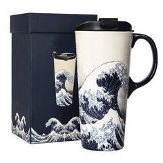 the great wave ceramic mug is next to its box